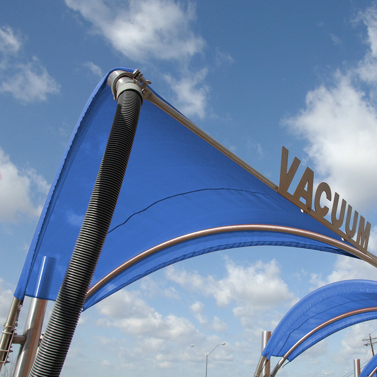 blue Tommy Car Wash vacuum canopy